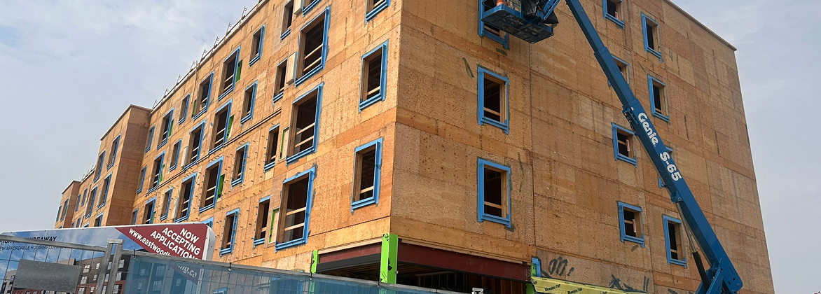 Panel being craned into place on site